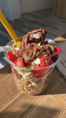 Coco bowl with strawberries and blueberries added