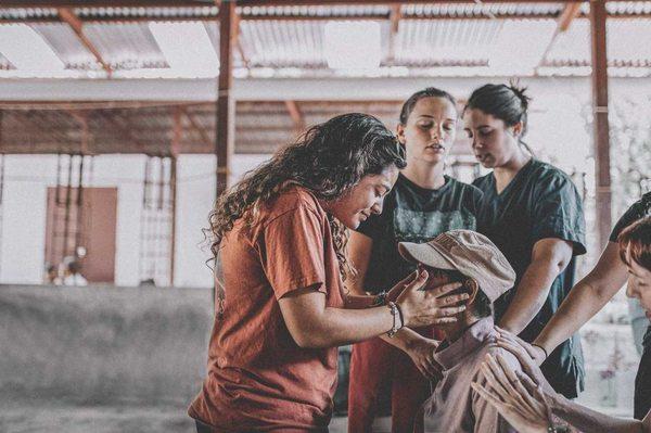 YWAM Orlando DTS Student praying for man in Nepal