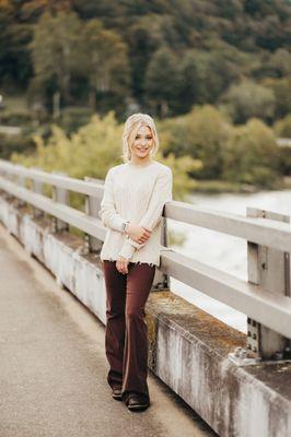 Model Lillian Weiss in Otter pants, sweater, and Garmin watch.