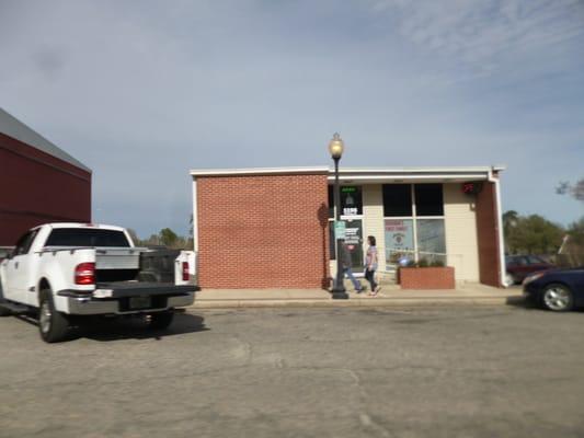 The front of the store...that expanse of brick would make a good painted sign.