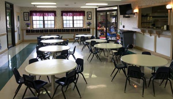 Children eat their meals in our warm and inviting café.