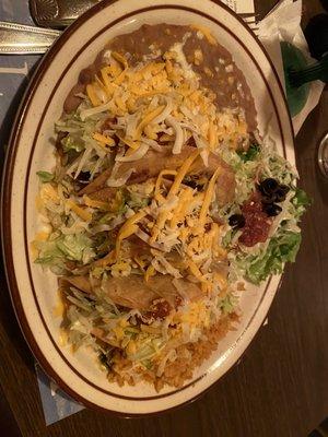 3 crispy shredded beef tacos and rice and beans