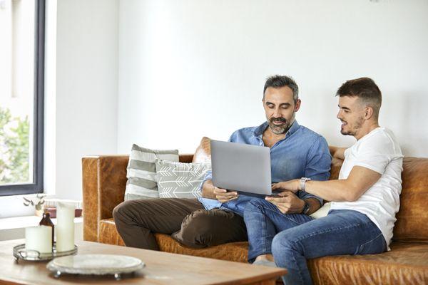 Two dads attending virtual, live Newborn Care for Intended Parents Class.