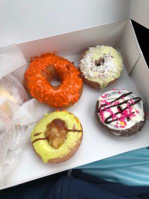 Orange crush, white chocolate, green apple and pina colada donuts. Fresh and so dang delicious