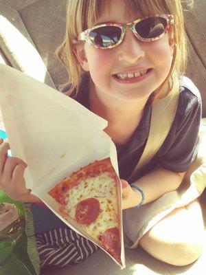 My granddaughter with her pizza slice