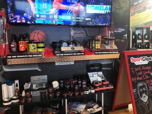 Waiting area with products and basketball game on the TV