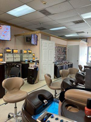 Inside view by pedicure, massage chairs.