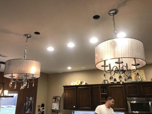 Added can lighting and chandeliers to this beautiful kitchen.