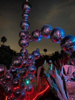 One of the many sculptures illuminated at night.