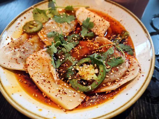 Spicy Lamb Dumplings: chili bamboo, cilantro, smoked dumpling sauce, & chili oil.