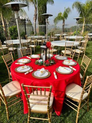 Gold Chiavari Tables, Chairs, chargers and heaters provided by Cosmo Event Rentals