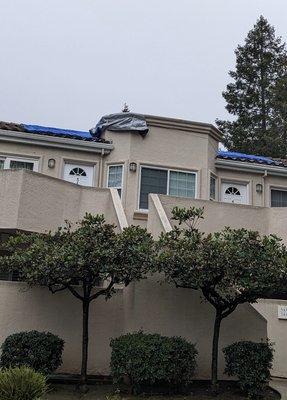 Tarps on the roof for the past 2.5 months. Negligence causing continuous water leak into units. Property Manager: Anna Jones