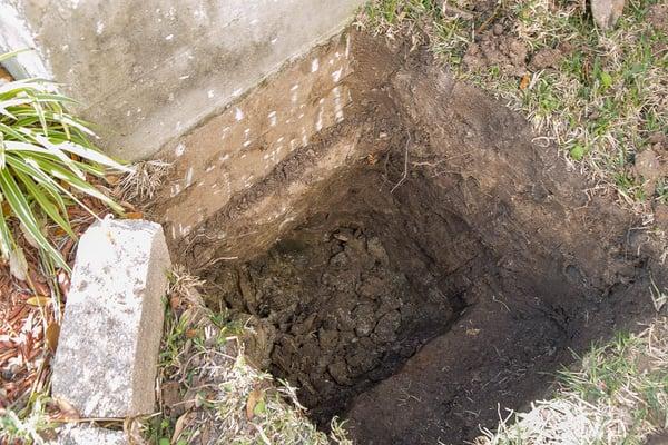 Concrete Grade Beam Carefully Exposed