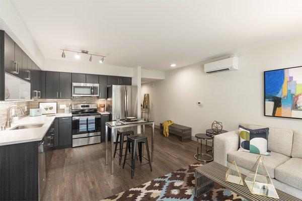 Air conditioning and hardwood-style flooring throughout in South Building apartments