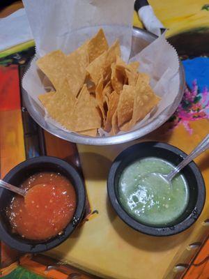 Complimentary salsa n chips. The red is spicier than El verde.