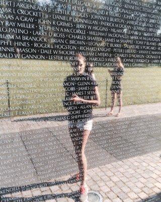 Honor Society member viewing Vietnam Memorial during Washington DC member trip.