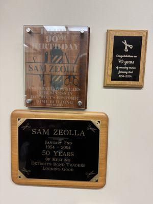 His plaques that customers have made!