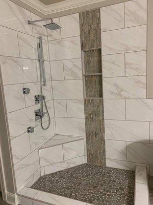 Tile shower installed for a bathroom remodel.