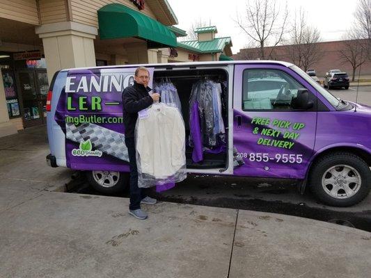 Deliveries being loaded in Dry Cleaning Butlers delivery van