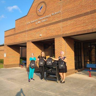 Dallas Dental Smiles donating Backpacks toSchools in Paulding County. Local Dallas Dentist.