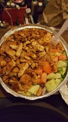 Grilled chicken over rice with salad