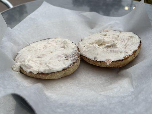 A rye bagel with lox shmear.