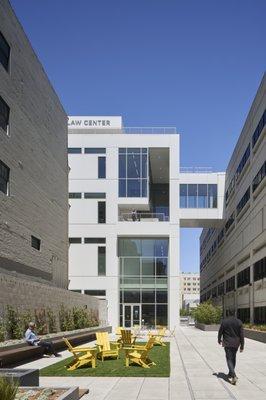 A student walks along the quad at UC Law San Francisco.