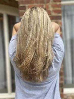 Fresh blonde highlights on long layered hair