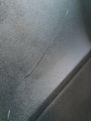 A deep crack in my back seat side panel.