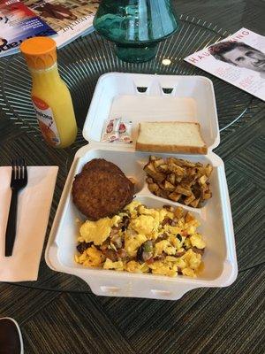 Southwestern scrambled eggs, potatoes, sausage, and "toast" (not toasted).