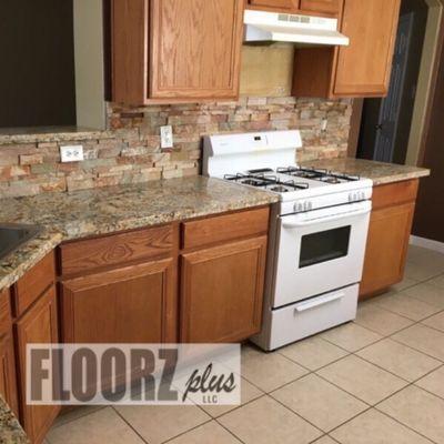 Granite countertop and stacked stone backsplash installation by Floorz Plus at 324 Rayford Road, Spring, TX 832-326-6998