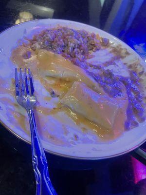 Enchilada plate with cheese, enchilada, queso, rice, and beans. next time we would get con carna sauce for better balance.