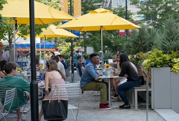 Enjoy lunch outside under yellow umbrellas for some shade.