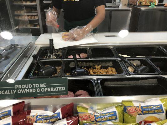 Sandwich Artist Preparing your Sandwich.