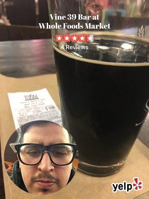 Drinking a stout waiting while they prepare the New York Steak I just bought for $5.50.