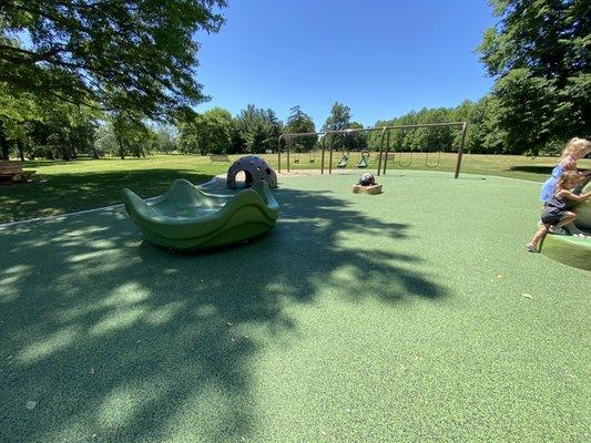 Swings, nature statues, spinning disk