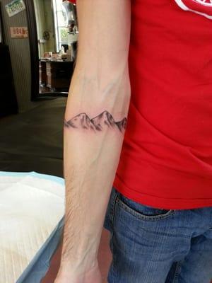 Jacob's mountain tattoo done by "Nut" Martin Sandoval.