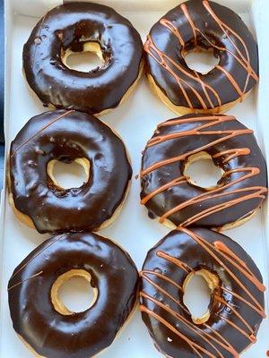 Half-dozen chocolate frosted donuts.