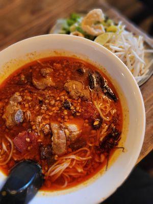 Northern Thai specialty noodle. Love it! But avoid if you're not into pork.