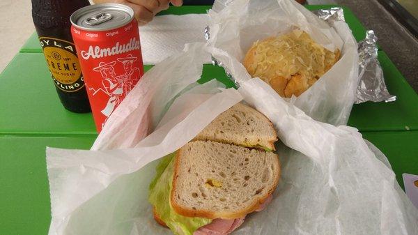 ? sandwich (we ordered corned beef but this certainly is not it...) and knackswurst roll. Almdudler is a soda from Austria.