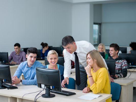 Students in computer lab with teacher