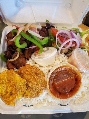 Fried pork, rice, tostones & salad. Black beans packaged separately.