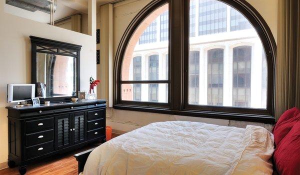 Blake master bedroom features an arched window and a spacious walk-in closet in select homes