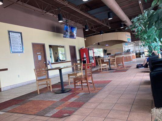 Clean open waiting area w/ TVs, Vending Machine, Coffee and comfy seating.