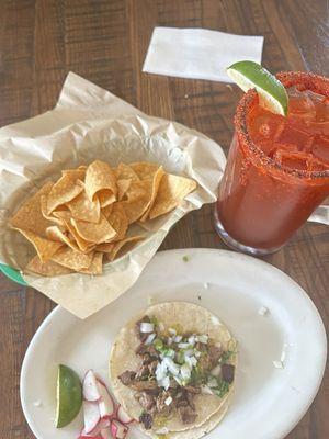 Steak tacos with a michelada