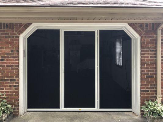 Lifestyle Screen with retractable door. Sandstone frame with black super screen.