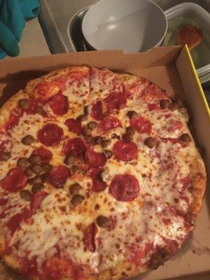 Half the toppings had slid off into the box.