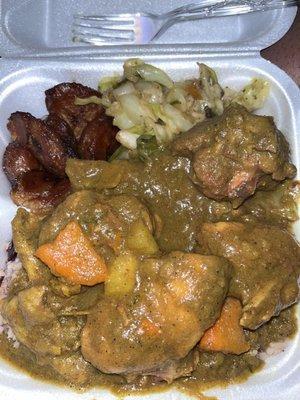 Curry chicken with rice & peas, cabbage and plantains