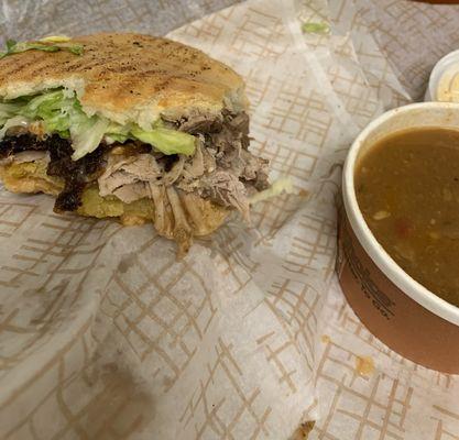 Pernil Sandwich with dipping sauce.