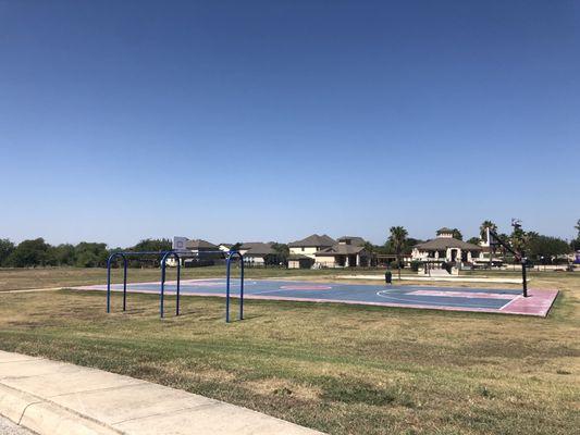 Volleyball court in background- no net